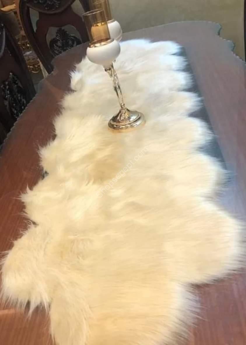 صورة المفرش الكامل: نص بديل: "مفرش سفرة فرو مستورد مقاس 150 × 40 سم بألوان متنوعة من متاجر مصر Shops Egypt" نص توضيحي: "مفرش سفرة فرو مستورد بألوان الرصاصي، الأسود، الأبيض، الأوف وايت، النبيتي، والكشمير. يعرض المفرش تصميمه الفاخر ومقاسه المناسب للطاولات." صورة close-up للملمس: نص بديل: "تفاصيل مفرش سفرة فرو مستورد يظهر نعومته وكثافته" نص توضيحي: "لقطة قريبة لملمس مفرش السفرة الفرو المستورد تظهر ناعوميته وكثافته وطول شعرة 5 سم." صورة المفرش على طاولة: نص بديل: "مفرش سفرة فرو مستورد موضوع على طاولة طعام لتوضيح الاستخدام" نص توضيحي: "مفرش السفرة الفرو المستورد على طاولة طعام، يبرز كيف يمكن أن يضيف لمسة من الأناقة والجمال لمائدتك." صورة للألوان المتاحة: نص بديل: "ألوان مختلفة لمفرش سفرة فرو مستورد: الرصاصي، الأسود، الأبيض، الأوف وايت، النبيتي، والكشمير" نص توضيحي: "عرض لألوان مفرش السفرة الفرو المستورد المتاحة من متاجر مصر Shops Egypt، بما في ذلك الرصاصي، الأسود، الأبيض، الأوف وايت، النبيتي، والكشمير."